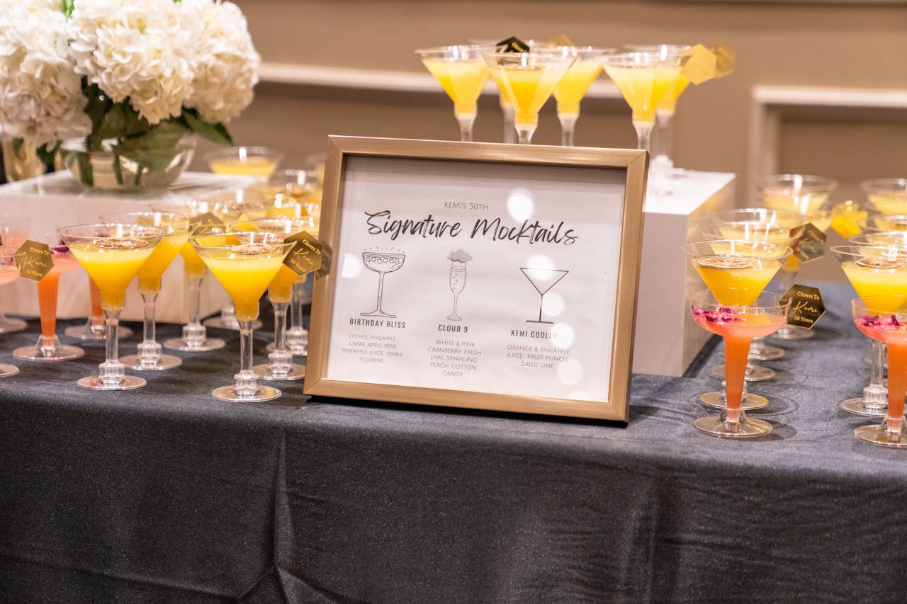 Vibrant selection of signature mocktails on display at a sophisticated indoor event.